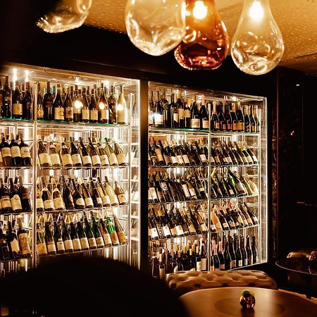 Hilton Rijeka Costabella Beach Resort And Spa Bagian luar foto Wine display at the restaurant