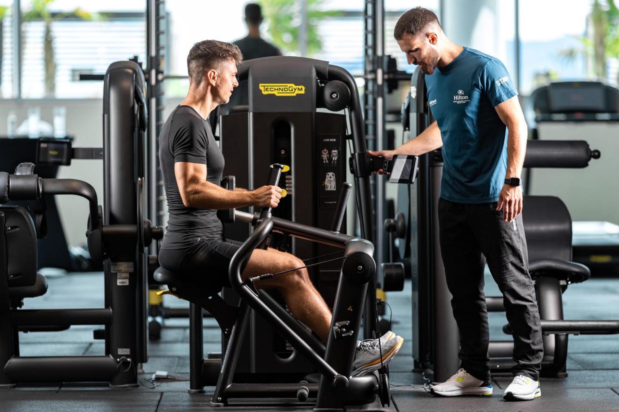 Hilton Rijeka Costabella Beach Resort And Spa Bagian luar foto Personal trainer with a client